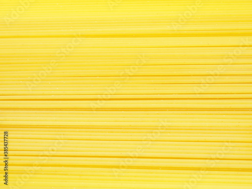 Uncooked of long spaghetti, close up. Concept of food background..