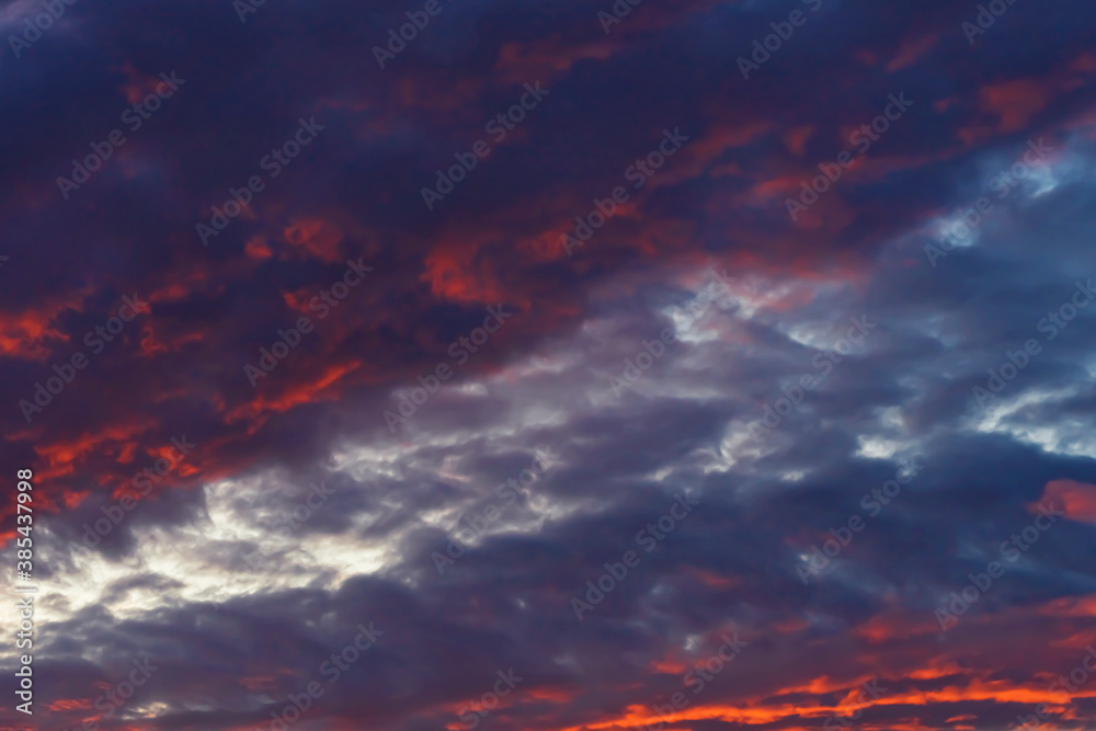 Clouds in the sky. Clouds at sunset. Sunset. The sky at sunset. Multi-colored clouds at sunset. Dark sky with clouds. Thick vapor texture. Natural abstraction. High in the sky. Dramatic background