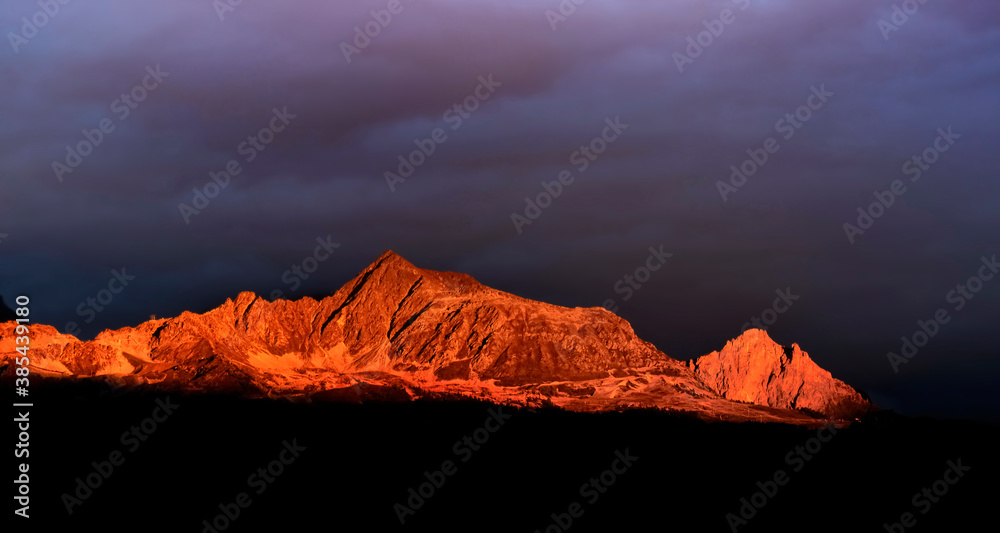 beautiful red mountain illuminated by the sun a the dawn