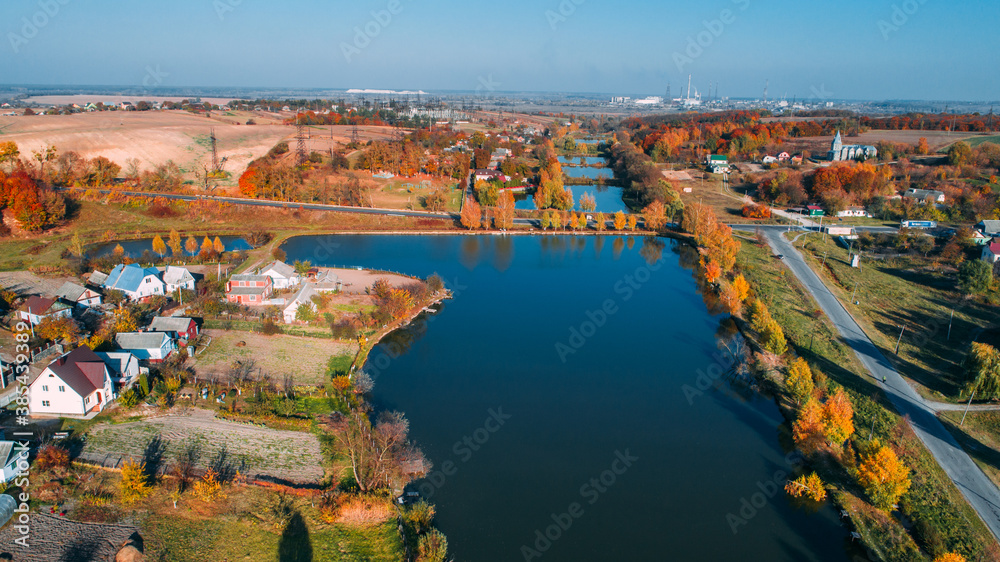 Obraz premium Autumn forest and river aerial drone view