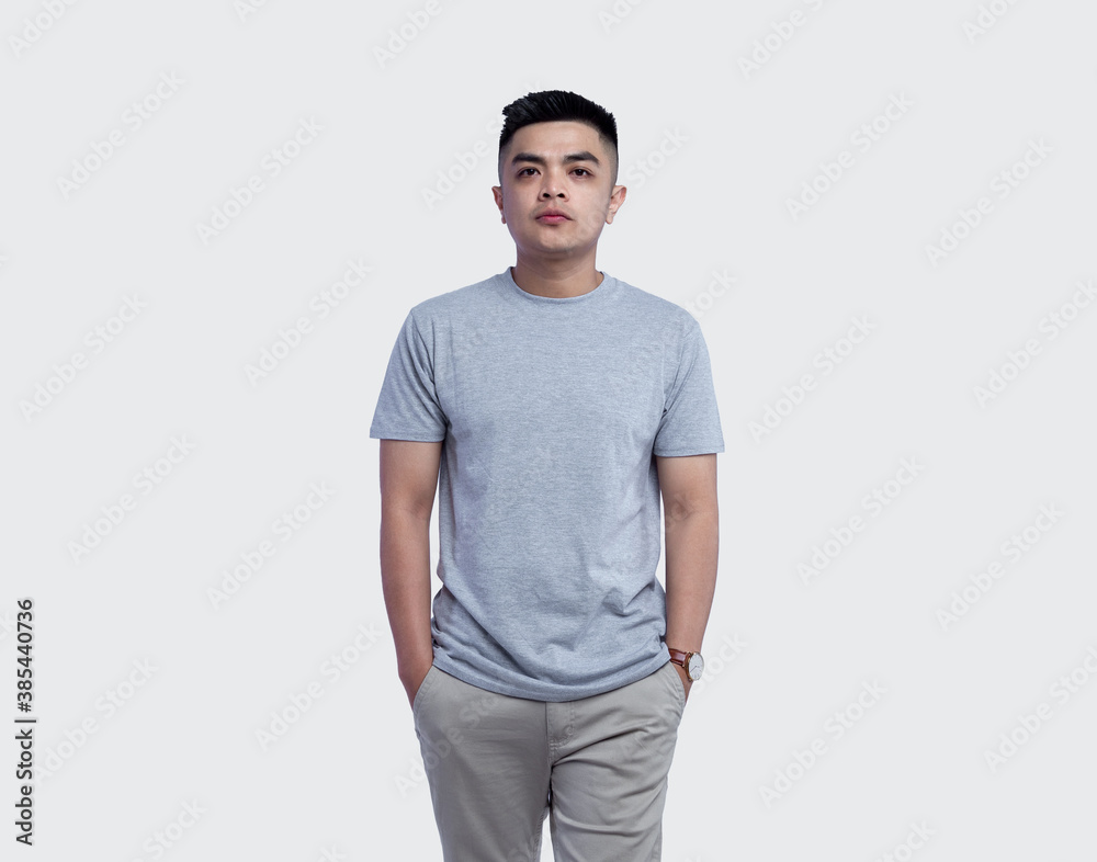Young handsome man was posing wearing heather grey t-shirt short sleeve with mockup concept Young handsome man was posing wearing heather grey t-shirt short sleeve with mockup concept
