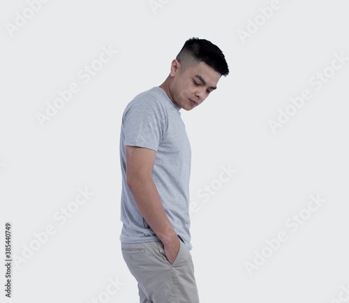 Obraz na plátně Young handsome man was posing wearing heather grey t-shirt short sleeve with moc
