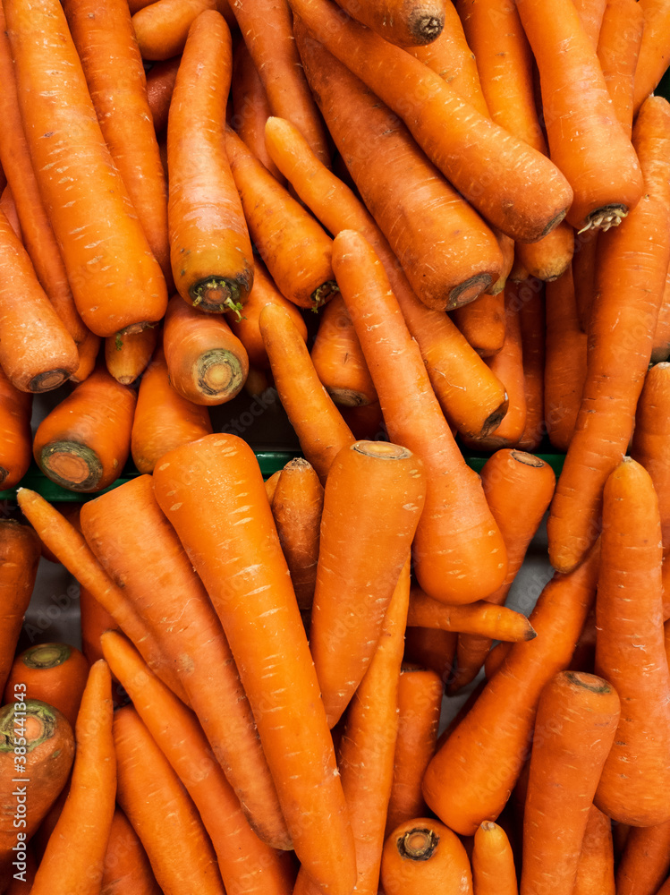 Carrots are arranged for background design. Piles of fresh vegetables to create designs about agriculture, food, nature, & healthy living. Carrots are arranged for background design. Piles of fresh vegetables to create designs about agriculture, food, nature, & healthy living.