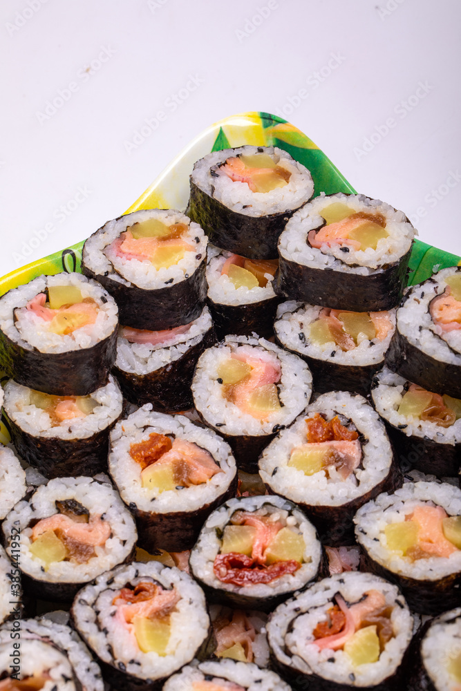 Top view of stack of Japanese sushi maki roll plate. Served in Japanese bar restaurant with chopstick Top view of stack of Japanese sushi maki roll plate. Served in Japanese bar restaurant with chopstick