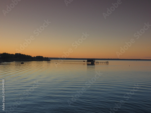 Sunset, summer, beautiful sky. Pier on the big Kama river. Ural, Russia, Perm Territory, Elovo. © Max G K