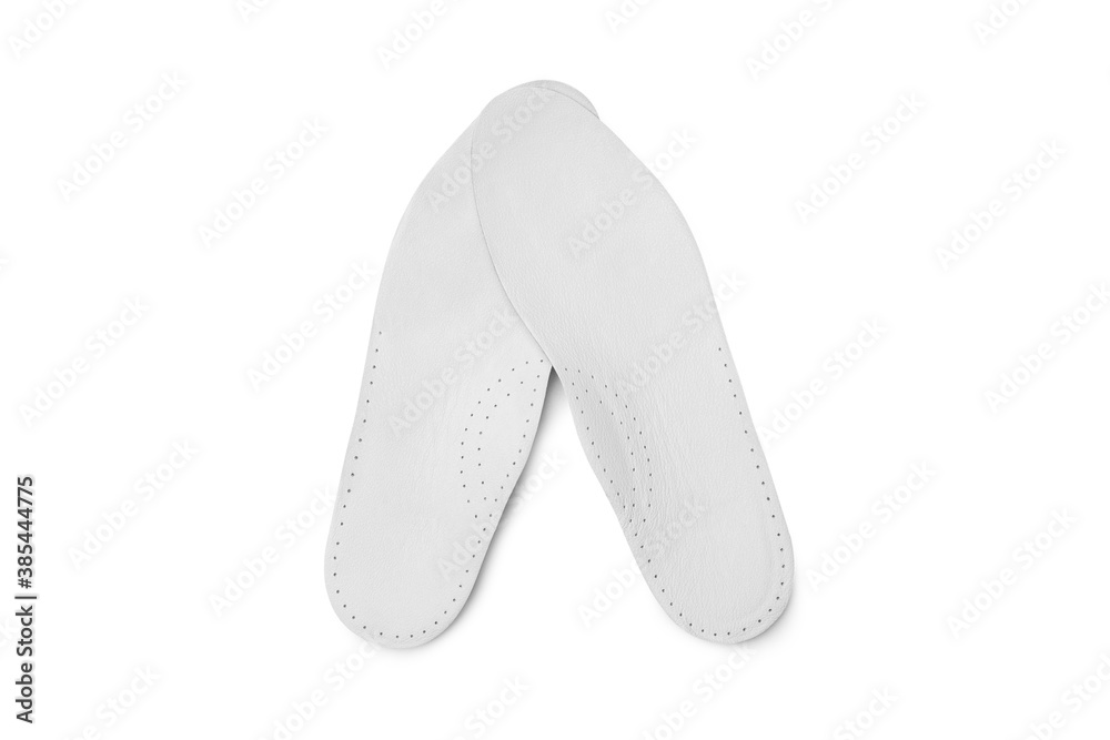 Isolated orthopedic insole on a white background. Treatment and prevention of flat feet and foot diseases. Foot care, comfort for the feet. Wear comfortable shoes. Medical insoles. Isolated orthopedic insole on a white background. Treatment and prevention of flat feet and foot diseases. Foot care, comfort for the feet. Wear comfortable shoes. Medical insoles.