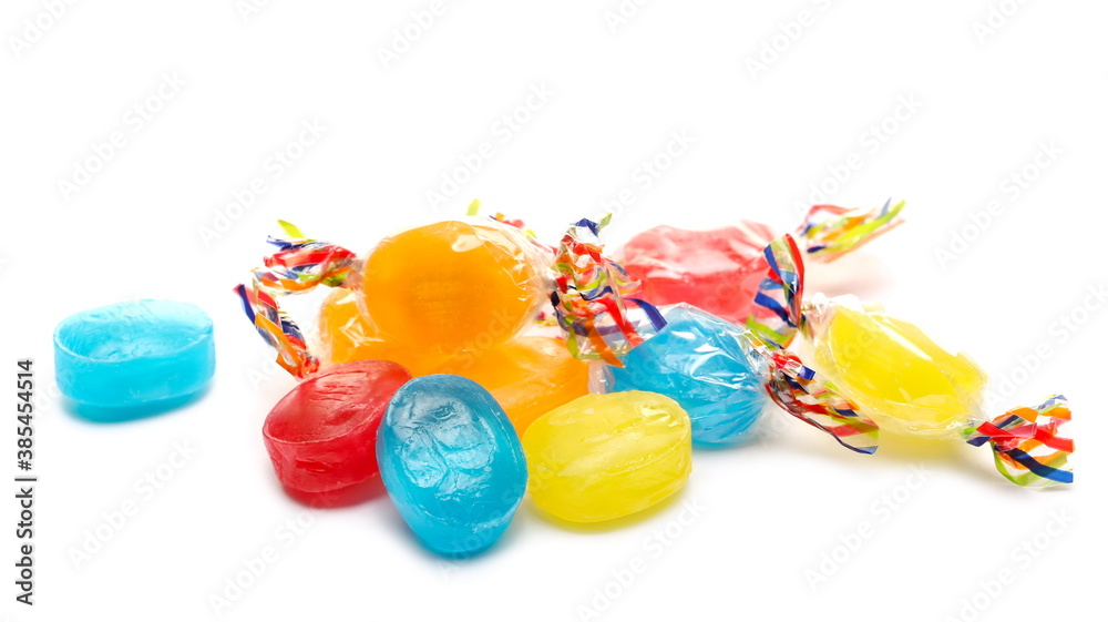 Φωτογραφία Colorful hard candies in transparent cellophane wrapping, sweets pile isolated o
