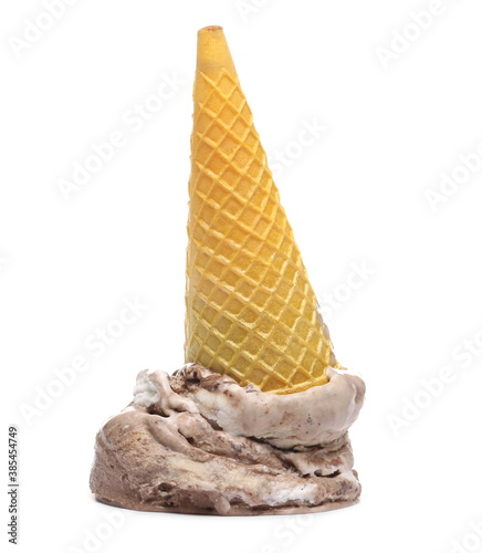 фотографія Chocolate and vanilla ice cream balls with yellow cone dropped on floor isolated