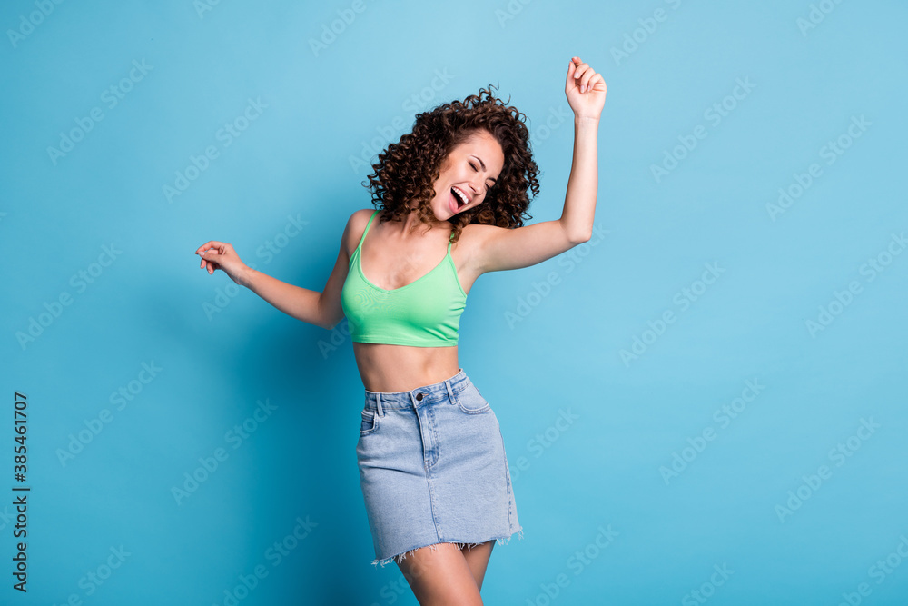 Naklejka premium Photo nice funky mad lady model yell discotheque close eyes raised arms hang out nightlife concert loud music clubber advert wear green top jeans skirt isolated pastel blue color background