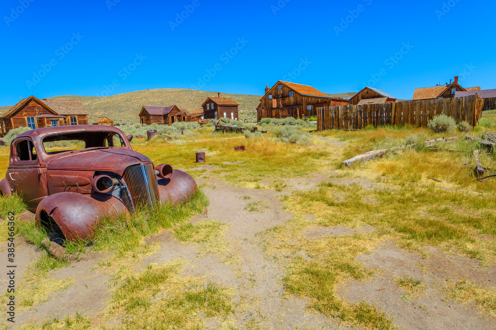 Rusty wreck of the vintage old car of the 1930s, in Bodie state historic park, Californian Ghost Town. The United States of America.