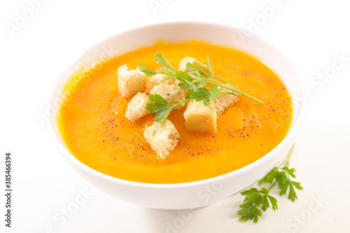 pumpkin or carrot soup on white background