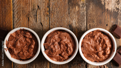 chocolate mousse- vegan chocolate dessert on wood background