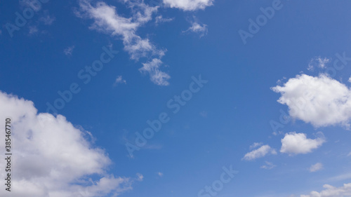 white clouds floating in blue sky