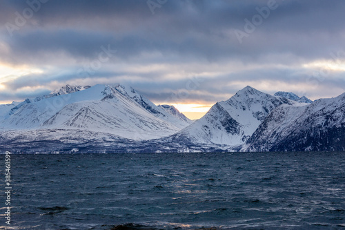 Beautiful winter landscape with mountains, sea and sunlight © sokko_natalia