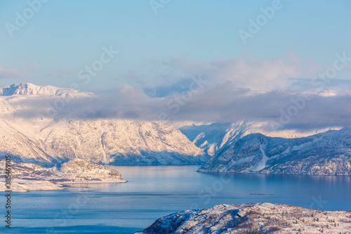 Beautiful winter landscape with mountains and fjord