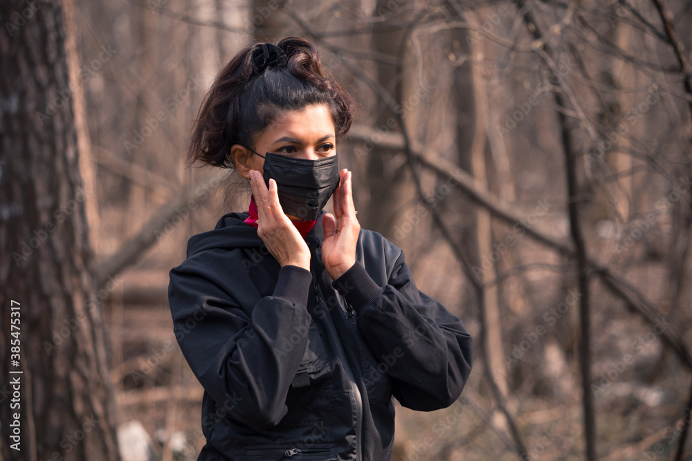 Girl in a medical mask to protect against the virus.