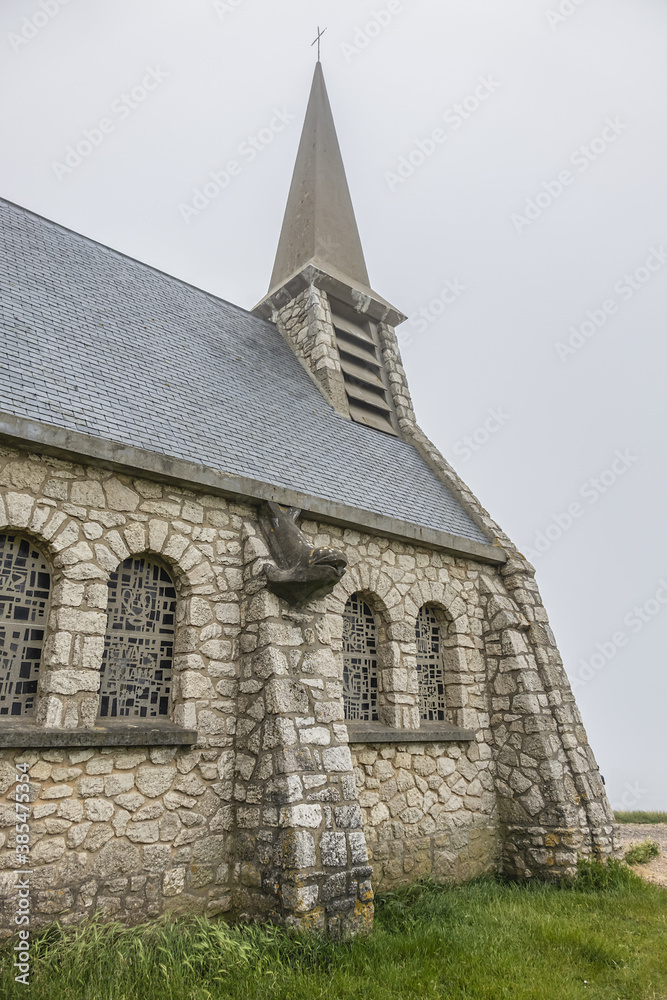 Fototapeta premium Chapel Notre Dame de la Garde in Etretat. August 6, 1856 chapel was blessed, chapel dedicated to Blessed Virgin. Etretat is a commune in Seine-Maritime department in Haute-Normandie region in France.