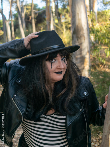 Woman posing in disguise for Halloween in a forest © Jess