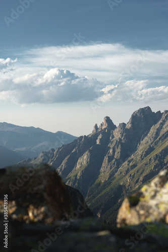 Evening alpine landscape calm background for tourism mountains and clouds at sunset