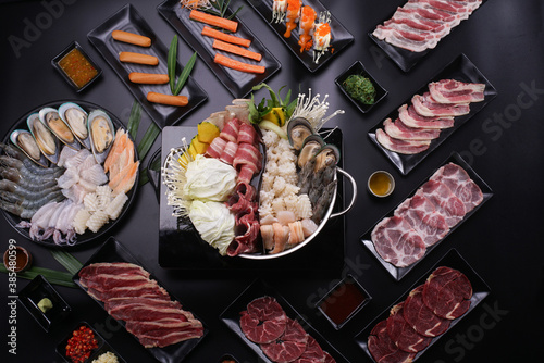 Shabu Shabu or Sukiyaki, a popular dish of pork, beef, shrimp, squid, seafood and fresh vegetables. Placed on a table with a boiling pot boiling.