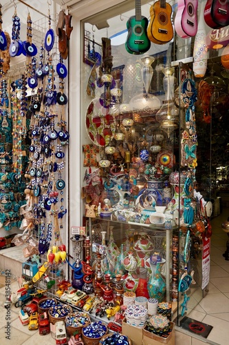 Bodrum, Turkey - August, 2020: Atmospheric local souvenir markets. Turkish Grand Bazaar. Hand-made souvenirs at street market. Souvenirs: wind music, dream catcher, evil eye keychain, beads, bracelets