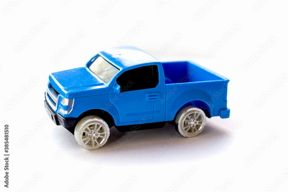 Children’s toy little blue car on a white background. Children’s toy little blue car on a white background.