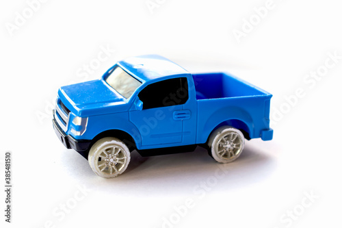 Children’s toy little blue car on a white background.