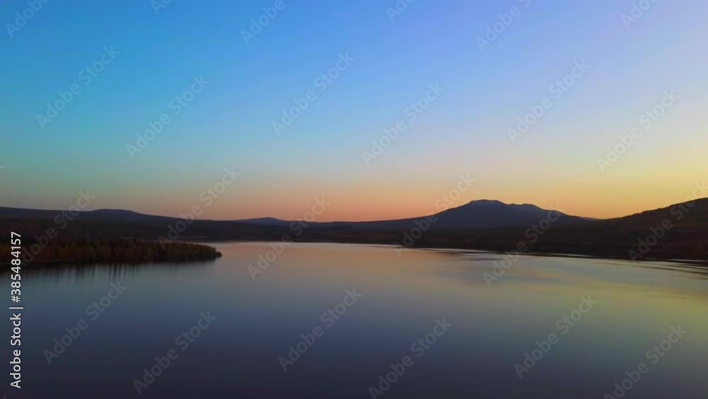 Aerial video of beautiful mountain lake on a frosty autumn morning. Aerial video of beautiful mountain lake on a frosty autumn morning.