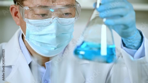 Hand of a scientist working in the laboratory. Vaccine development concept.