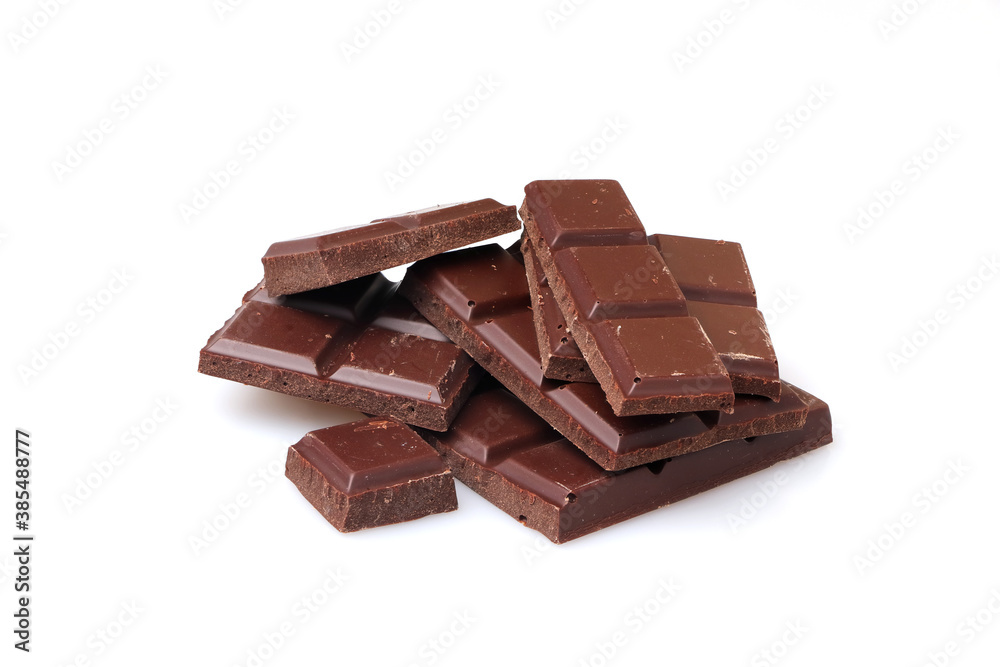Pieces of dark chocolate on a white background. Pieces of dark chocolate on a white background.