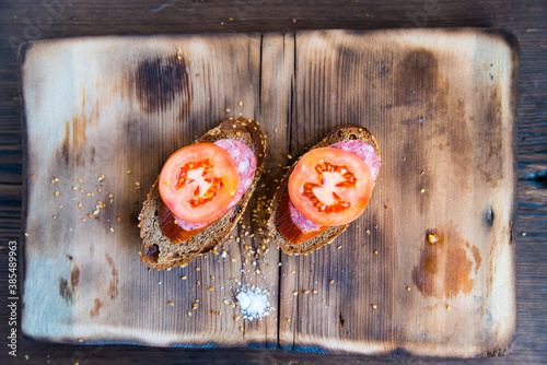 Sandwiches on a wooden Board,with tomato slices with bread slices,still life photo