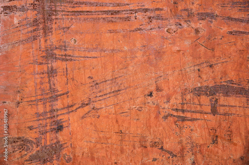 Texture of orange paint with rust on old iron. Background.