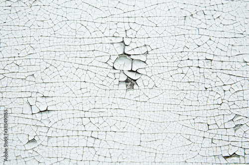 Texture of an old cracked white paint. Background photo