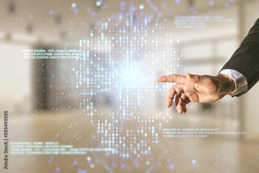 Double exposure of male hand working with abstract virtual creative code skull hologram on blurred office background. Malware and cyber crime concept Double exposure of male hand working with abstract virtual creative code skull hologram on blurred office background. Malware and cyber crime concept