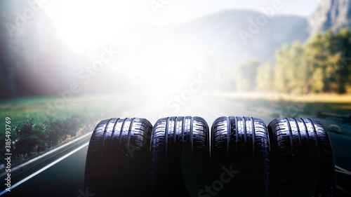 Tire on autumn road. Banner concept.