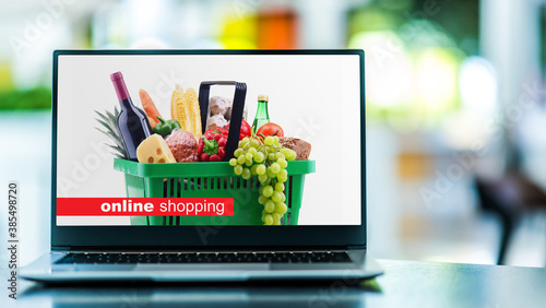 Laptop computer displaying an online shopping website photo