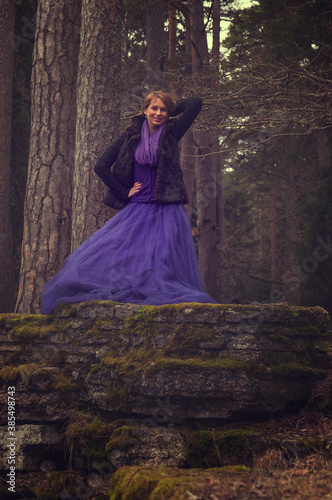 woman in forest with violet dress