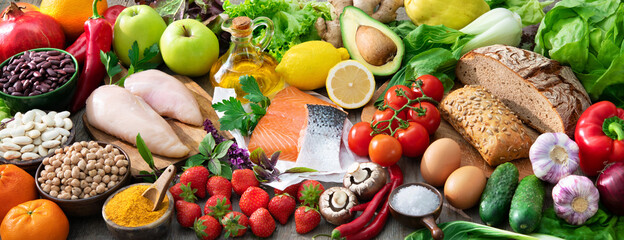Composition with assorted organic food products on wooden table