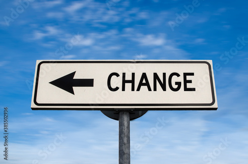 Change road sign, arrow on blue sky background. One way blank road sign with copy space. Arrow on a pole pointing in one direction.