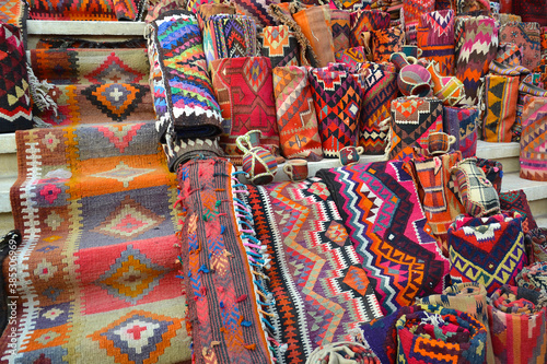 Colorful carpets  blankets and souvenirs exposed on the steps of a bazaar in Erbil  Iraq.