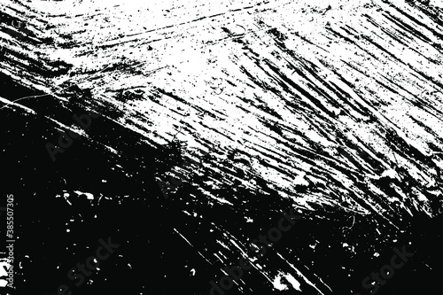 Black and white grunge texture. Black streaks of paint  ink  and dirt. Abstract monochrome background. Pattern of scratches  chips  and wear