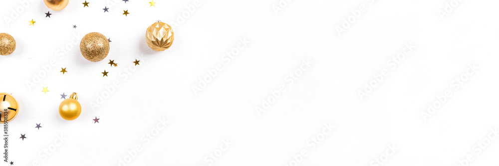Fototapeta premium Festive white background with gold Christmas decorations. Flat lay, top view. Copy space for text.