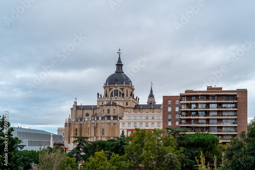 Skyline of Almudena Cathedral of Madrid. Exterior view from Vistillas Park at sunset