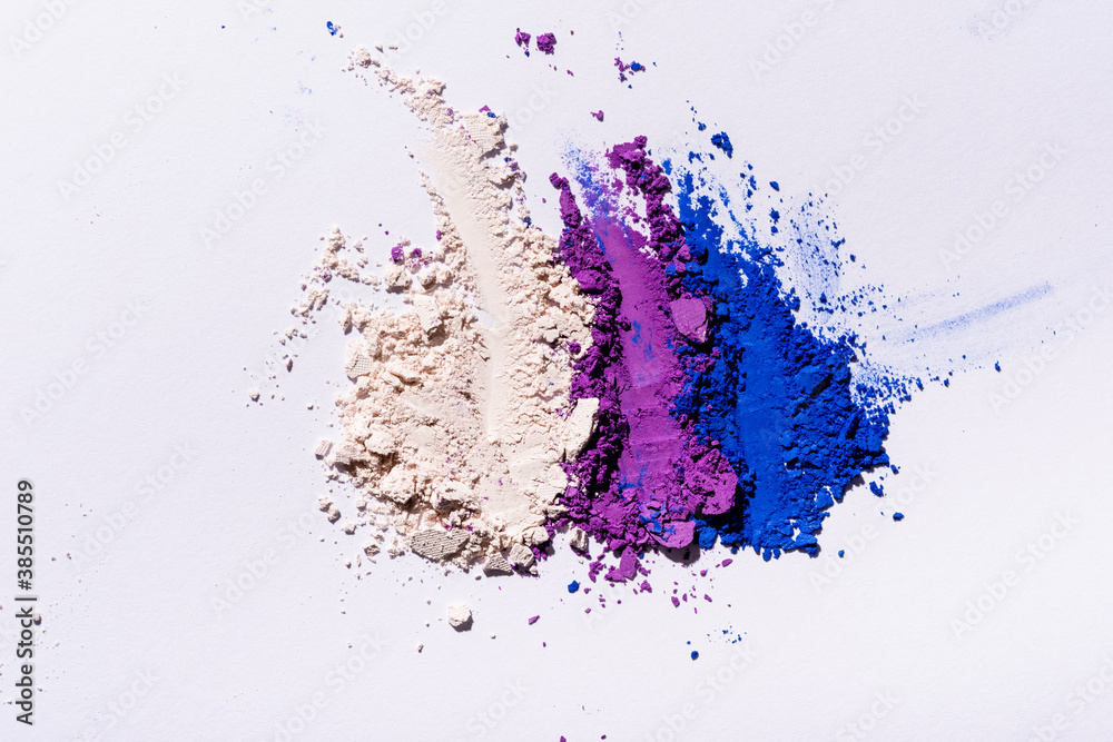top view of purple, blue and white eyeshadow powder