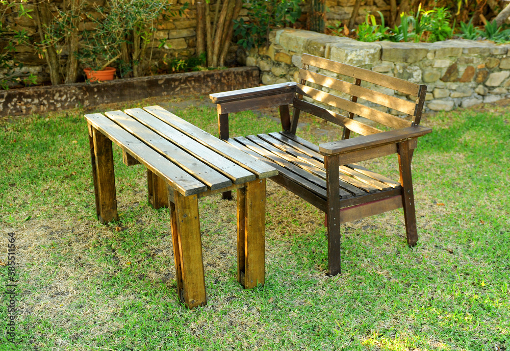 Recycled pallet wood garden bench and table, hipster decor concept Recycled pallet wood garden bench and table, hipster decor concept