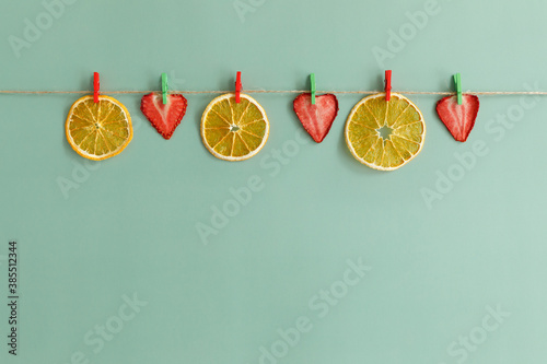 Fruit chips are dried on a rope.