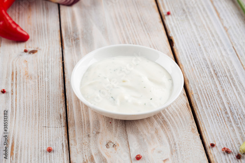 Side view on white sour cream sauce