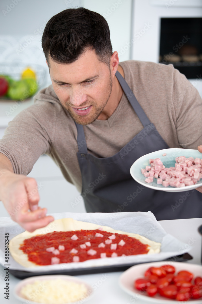closeup of man making pizza