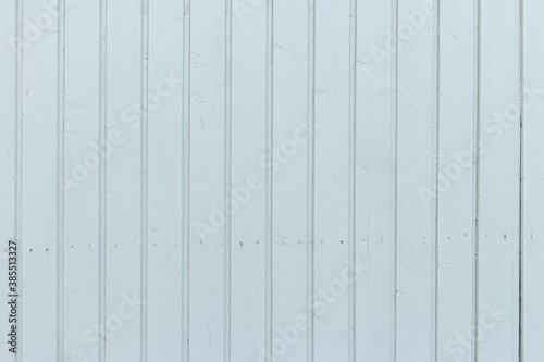 Light gray vertical wood cladding.