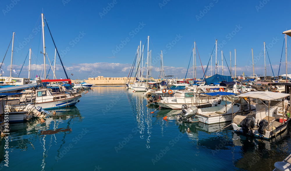Panoramic view of yacht port and marina at Mediterranean coastline beneath Old City of Jaffa in Tel Aviv Yafo, Israel